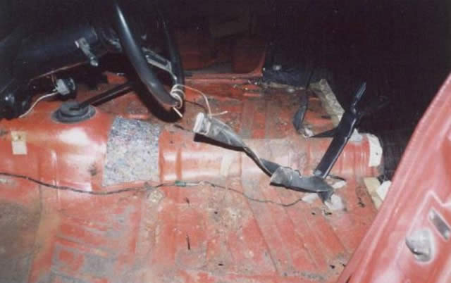 Just thought id throw in a pic of the floor b4 the rust was sraped down and painted over. The truck had 2 Kmart bucket seats in it when we got it and had another seat in it of some kind before them. The factory bench seat was before all of them. The problem is that no one patched the holes from the previous seat(s), so a lot of water got in and was starting to eat it away. I got it under control though.